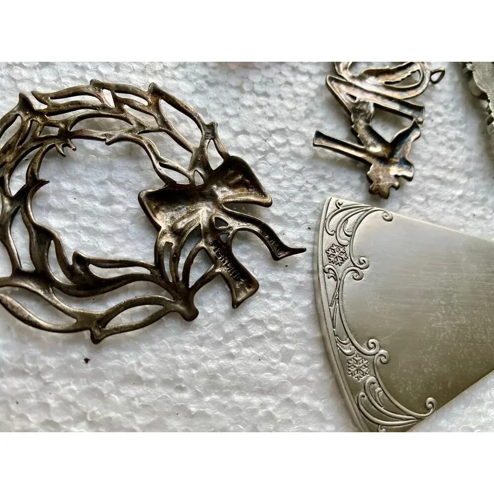 vintage-style metal holiday decorations features silver-toned pewter ornaments